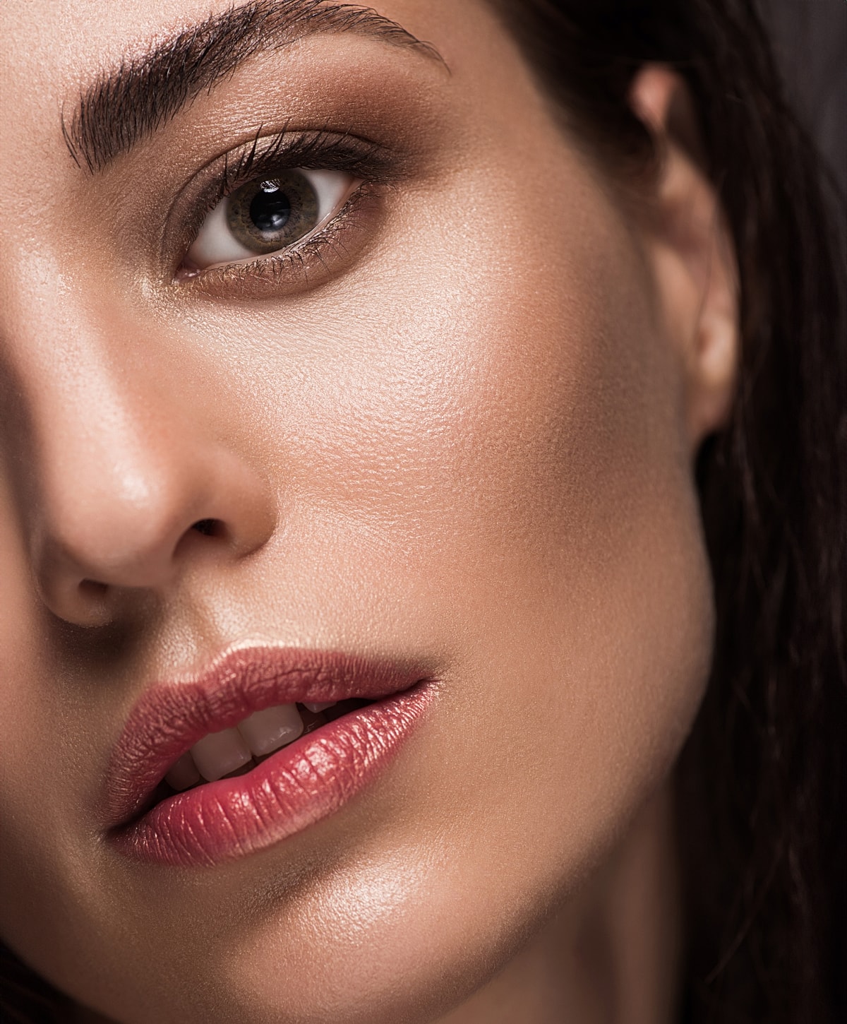 Close-up of woman's face with natural makeup.