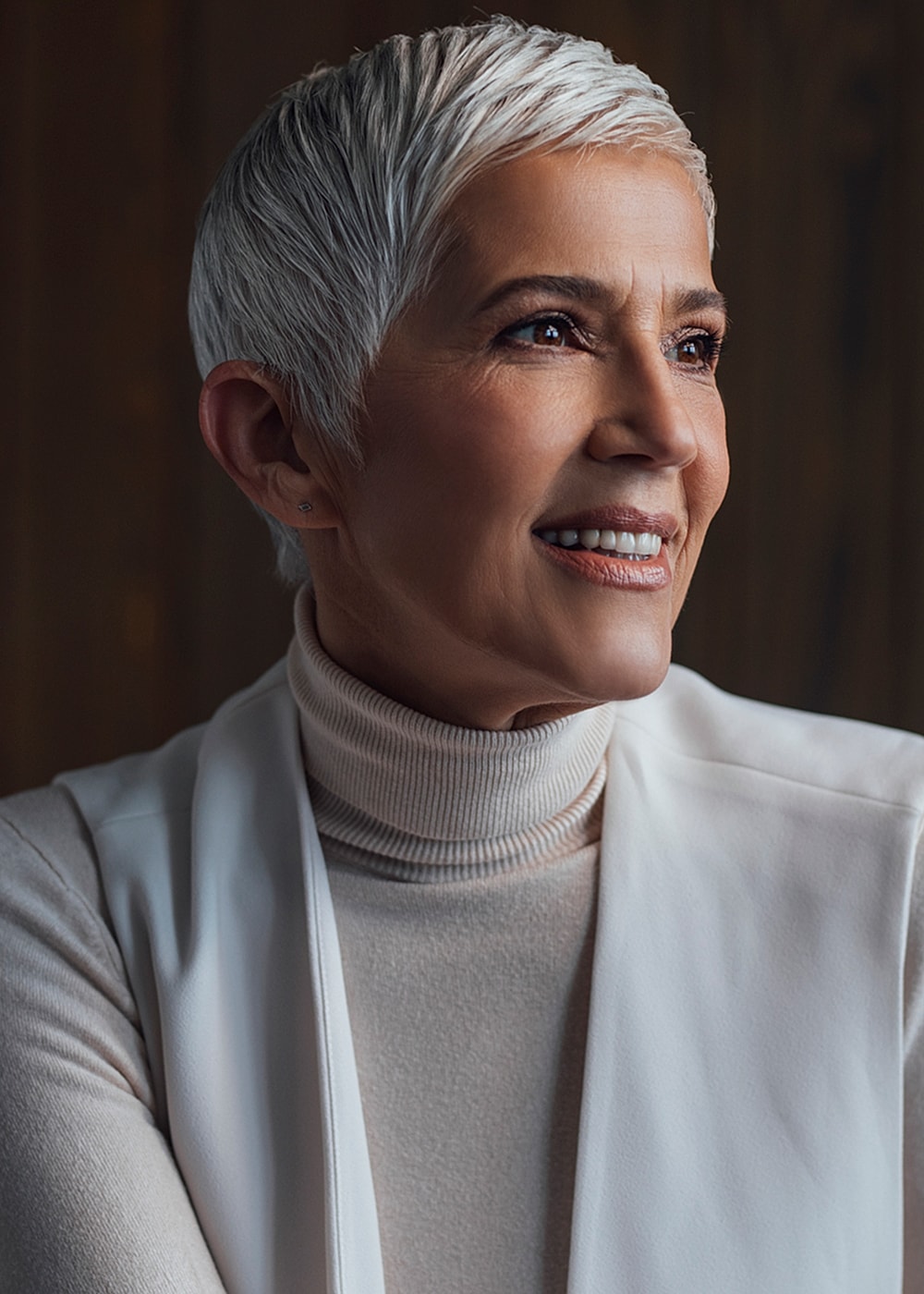 Smiling older woman in a turtleneck sweater.
