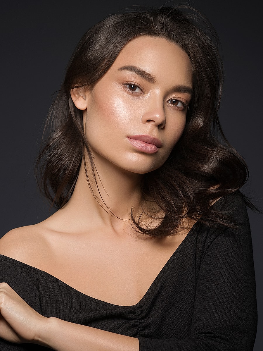 Portrait of a woman with long, dark hair.