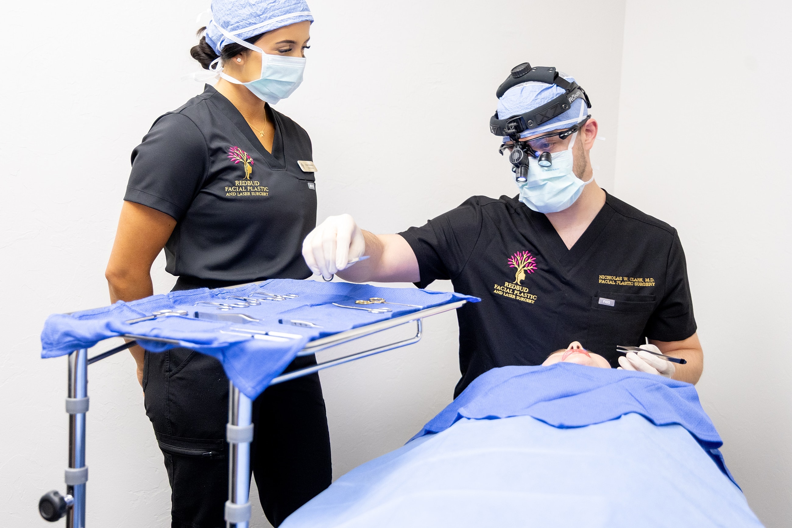 Medical professionals preparing for a surgical procedure.