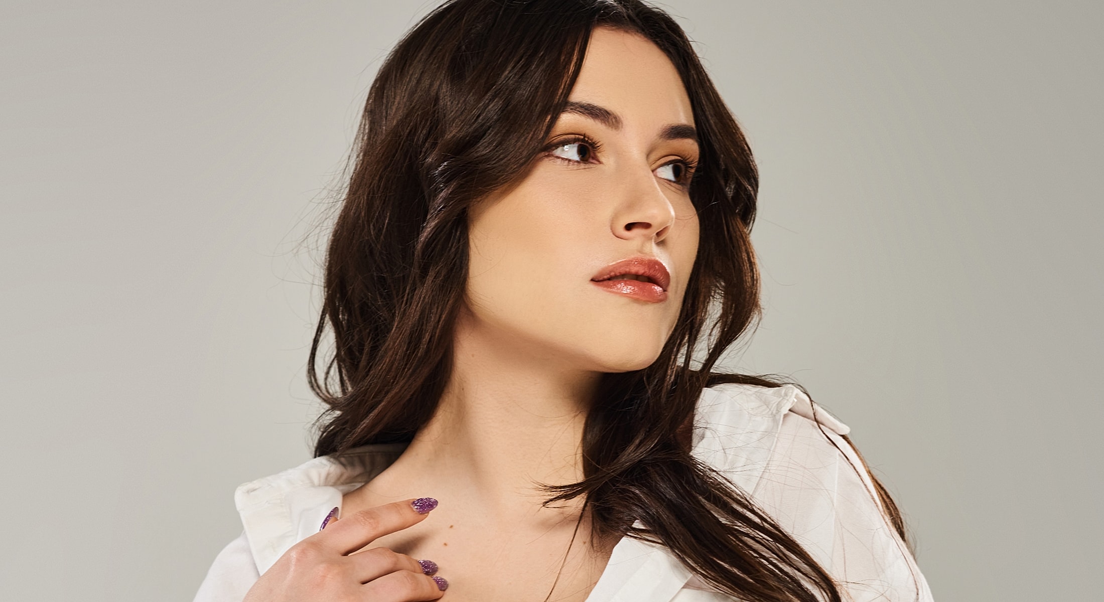 Woman with long hair and elegant pose.