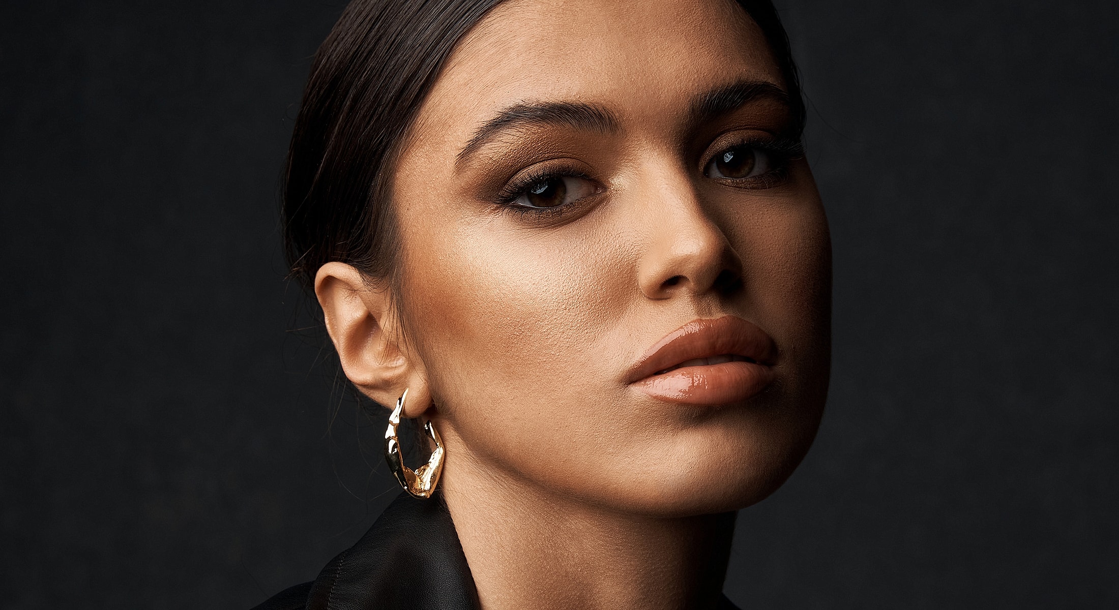 Portrait of a woman with bold makeup.